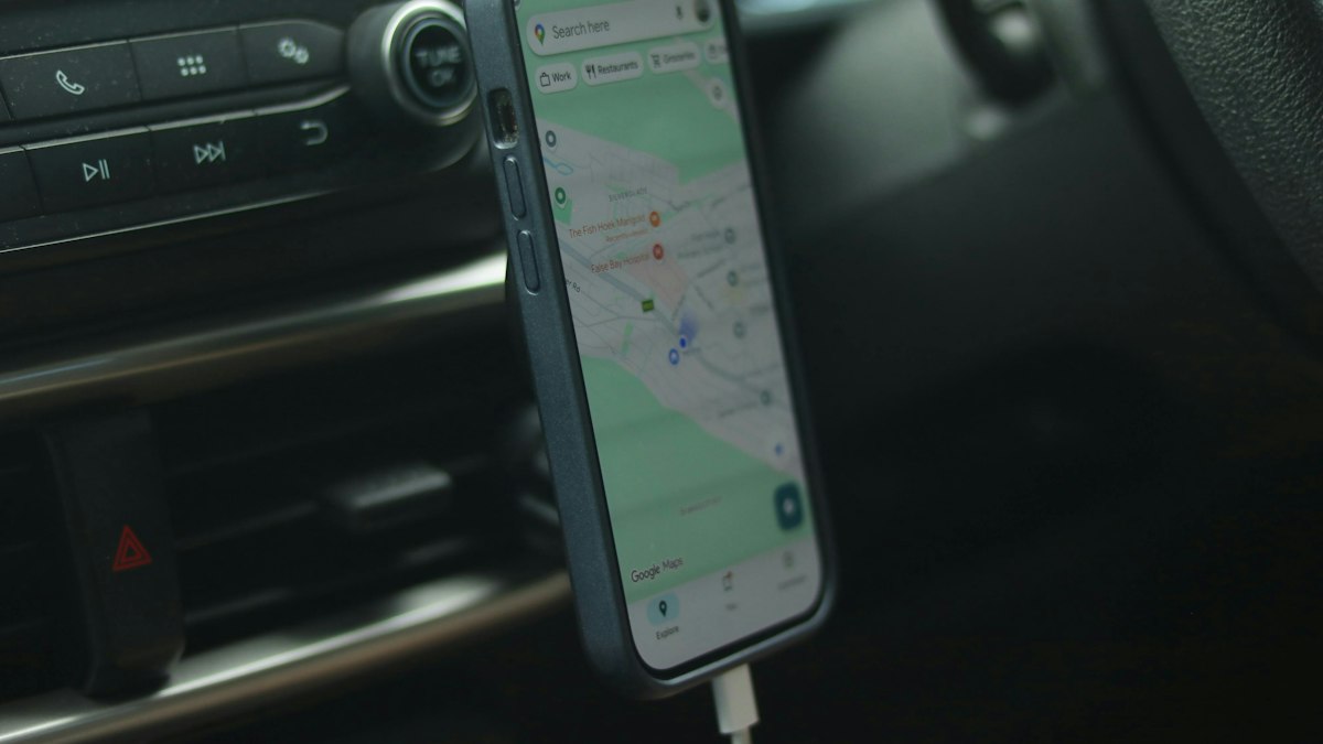Phone with a navigation app mounted in a car