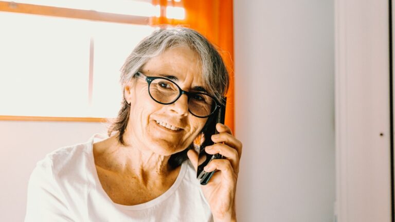 Smiling older woman talking on her phone