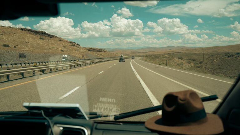 Prepaid Data Plans for Road Trips Across the US Desert highway seen from inside a car